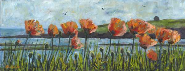 Poppies in grass beside the sea