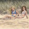 Two girls lazing on the beach