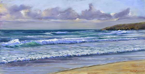 waves on to a golden sand beach